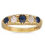 AN ANTIQUE DIAMOND AND SAPPHIRE FIVE STONE RING, to a 18ct gold carved ring mount. Size: R