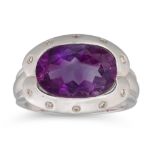 AN AMETHYST AND DIAMOND SET RING, by Tanya Page — Hong Kong, the large oval amethyst surrounded by
