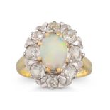 A VINTAGE OPAL AND DIAMOND CLUSTER RING, the central opal to a diamonds surround, mounted in 18ct