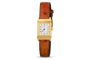 A LADY'S 18CT YELLOW GOLD JAEGER - LE COULTRE 'REVERSO' WRISTWATCH, silvered face with Arabic
