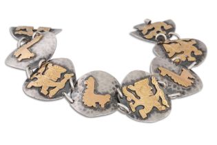 A PERUVIAN BRACELET, silver with 18ct plated overlay of animal motifs