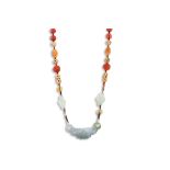 AN ORIENTAL JADE AND CARNELIAN BEADED NECKLACE, each bead carved and knotted
