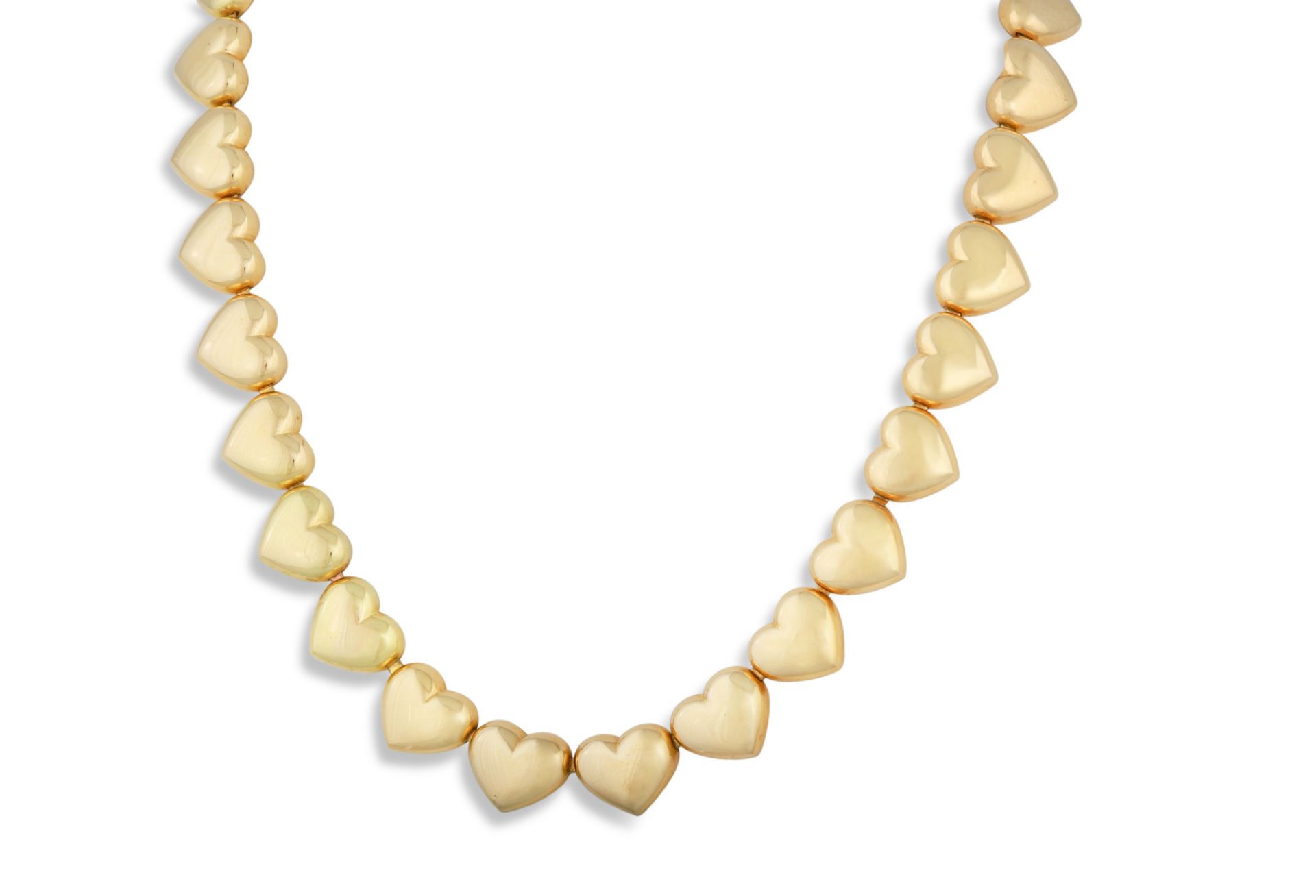 A MAUBOUSSIN NECKLACE, in 18ct yellow gold, each link formed as a heart shaped panel, signed