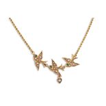 A VICTORIAN SEED PEARL NECKLACE, modelled as swallows in flight, in 9ct gold, antique case