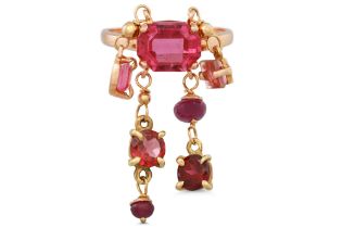 A TOURMALINE RING, the oval tourmaline suspending smaller oval tourmaline drops, mounted in gold,