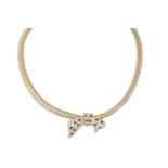 A VINTAGE NECK PIECE, the flattened snake link chain set with a central diamanté bow shaped panel, c