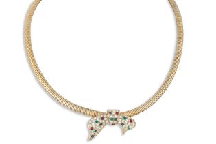 A VINTAGE NECK PIECE, the flattened snake link chain set with a central diamanté bow shaped panel, c