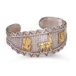 A PERUVIAN BANGLE, silver with 18ct plated overlay of animal motifs