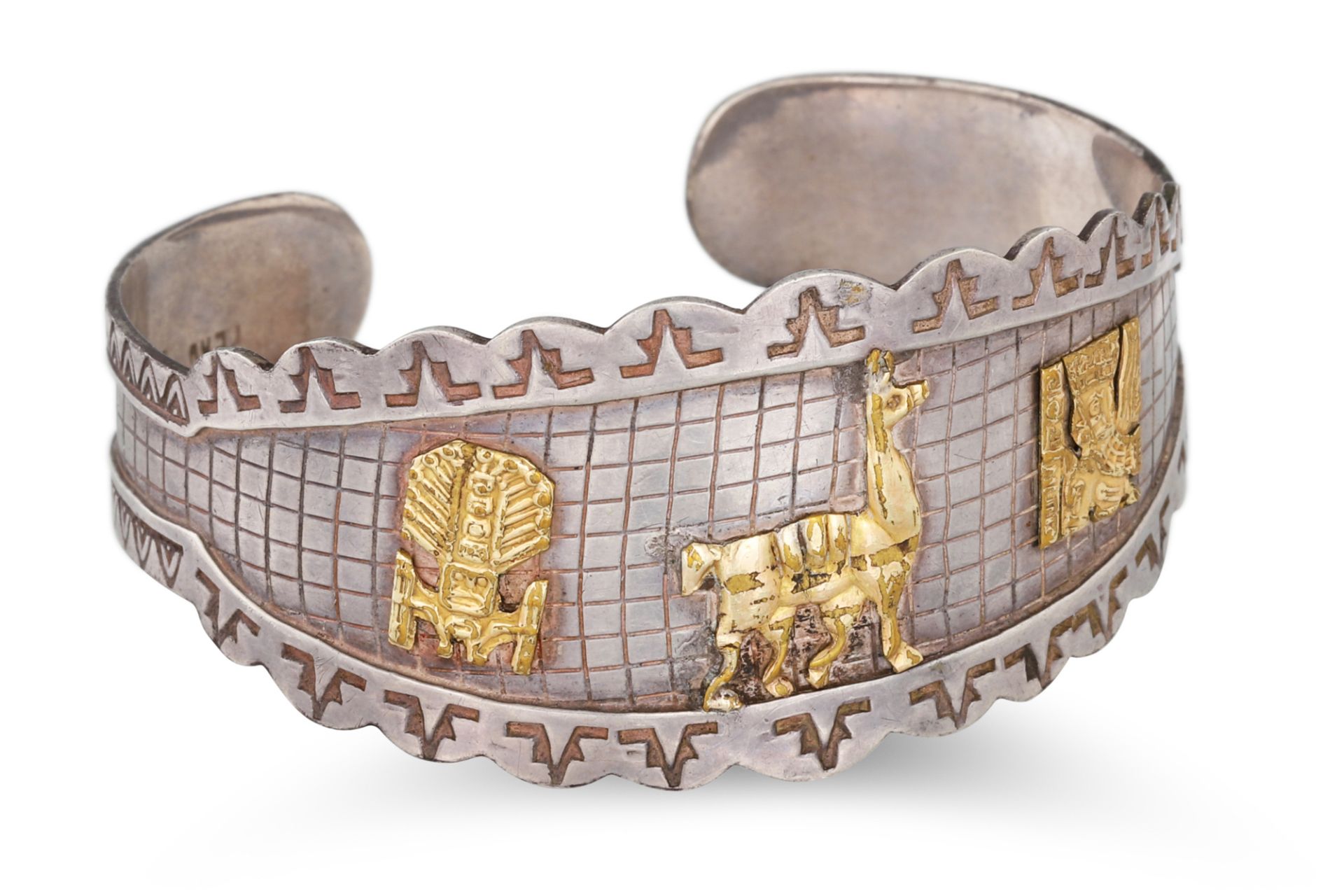 A PERUVIAN BANGLE, silver with 18ct plated overlay of animal motifs