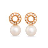 A PAIR OF DIAMOND AND CULTURED PEARL EARRINGS, the circular diamond plaques suspending pearls, in