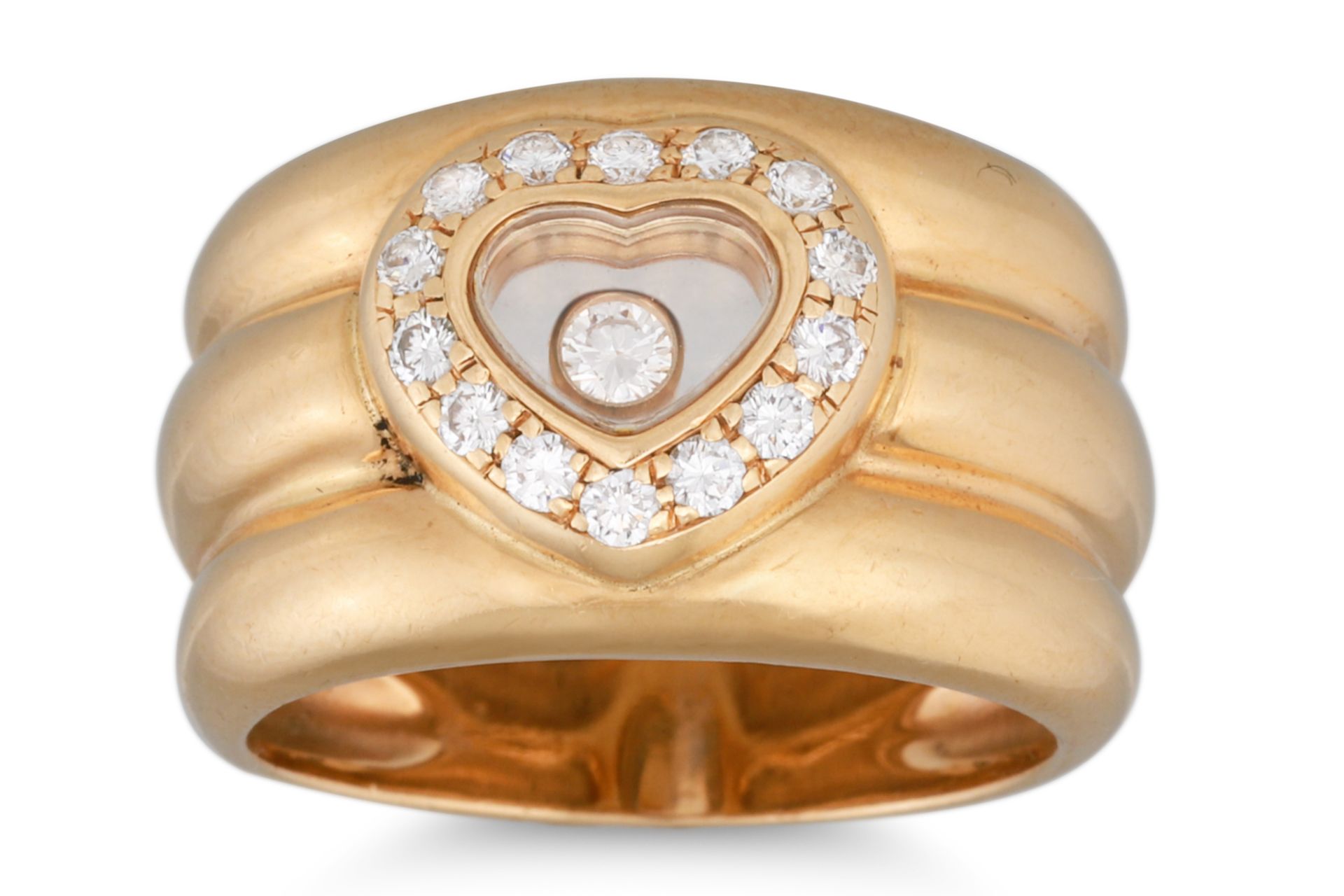 A CHOPARD HAPPY DIAMOND RING, comprising a diamond set heart shaped panel enclosing a diamond