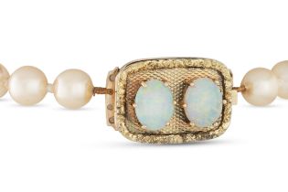 A SET OF VINTAGE CULTURED PEARLS, with a gold and opal clasp, dated 1934 verso