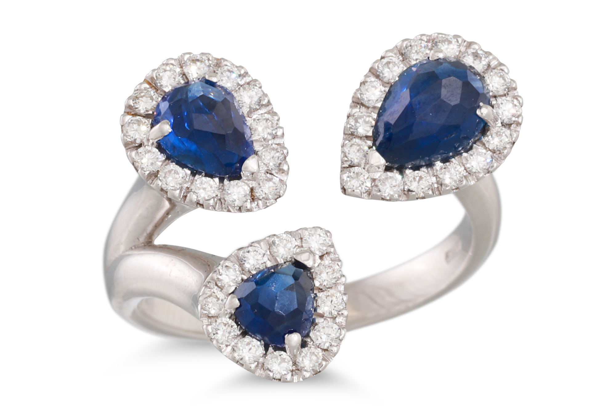 A DIAMOND AND SAPPHIRE TRIPLE CLUSTER RING, comprising three pear shaped clusters, mounted in 18ct