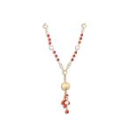 A GOLD, CORAL AND PEARL NECKLACE, the beaded necklace suspending large gold bead and coral and pearl