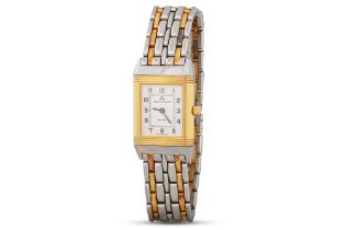 A LADY'S STAINLESS STEEL BI COLOUR JAEGER - LE COULTRE REVERSO WRISTWATCH, silvered face with Arabic