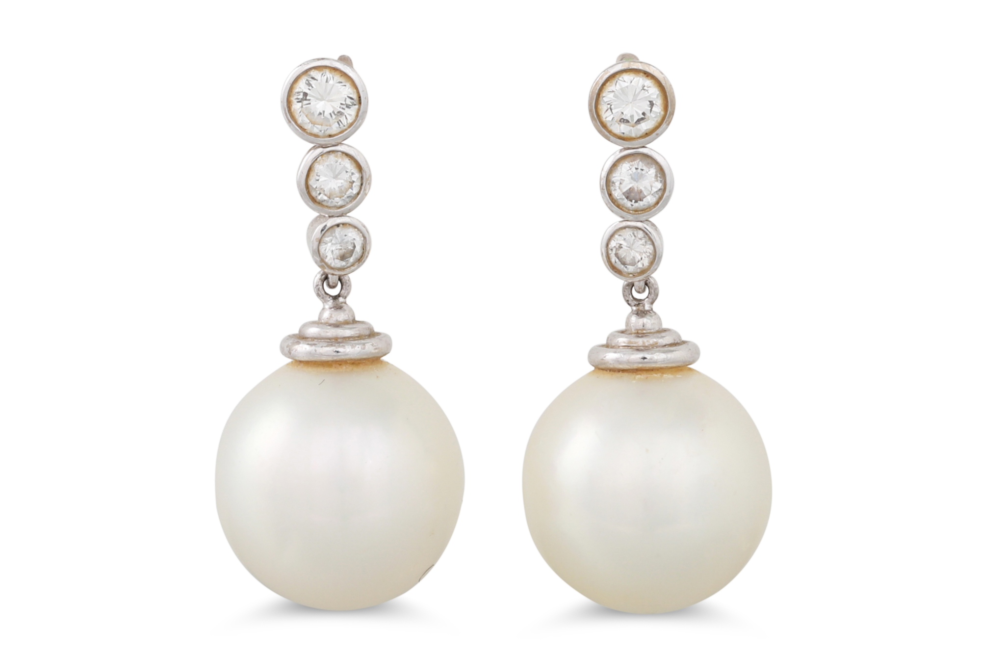 A PAIR OF PEARL AND DIAMOND DROP EARRINGS, the brilliant cut diamonds suspending pearl drops,