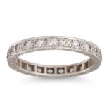 A VINTAGE DIAMOND ETERNITY RING, the circular diamonds mounted in 9ct gold, with engraved mount.