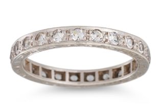 A VINTAGE DIAMOND ETERNITY RING, the circular diamonds mounted in 9ct gold, with engraved mount.
