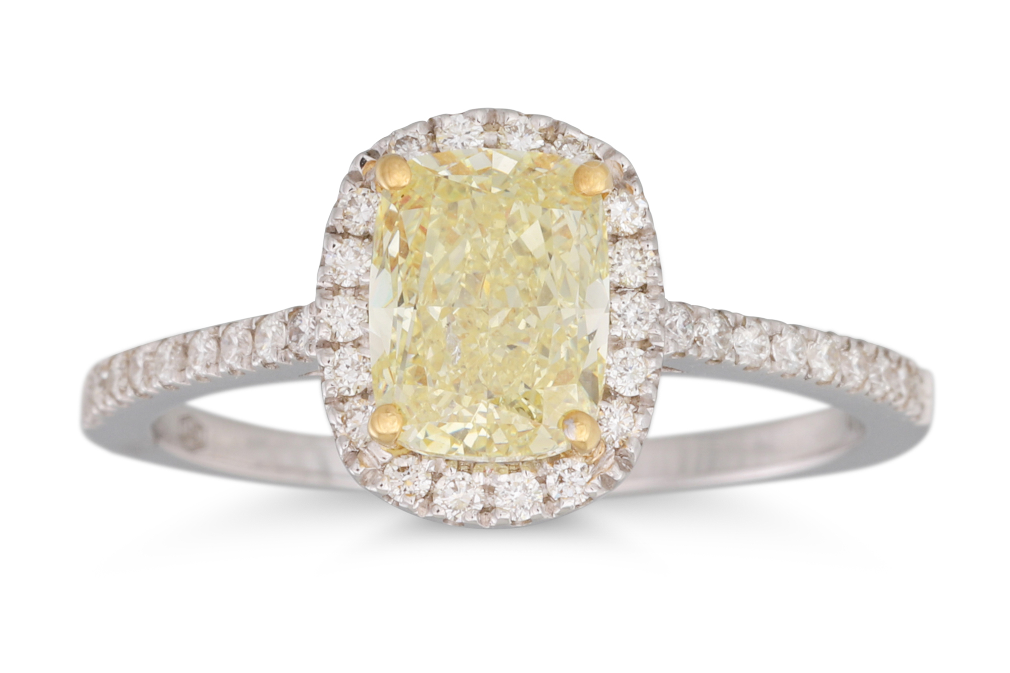 A DIAMOND CLUSTER RING, the fancy yellow cushion cut diamond to diamond surround and shoulders,