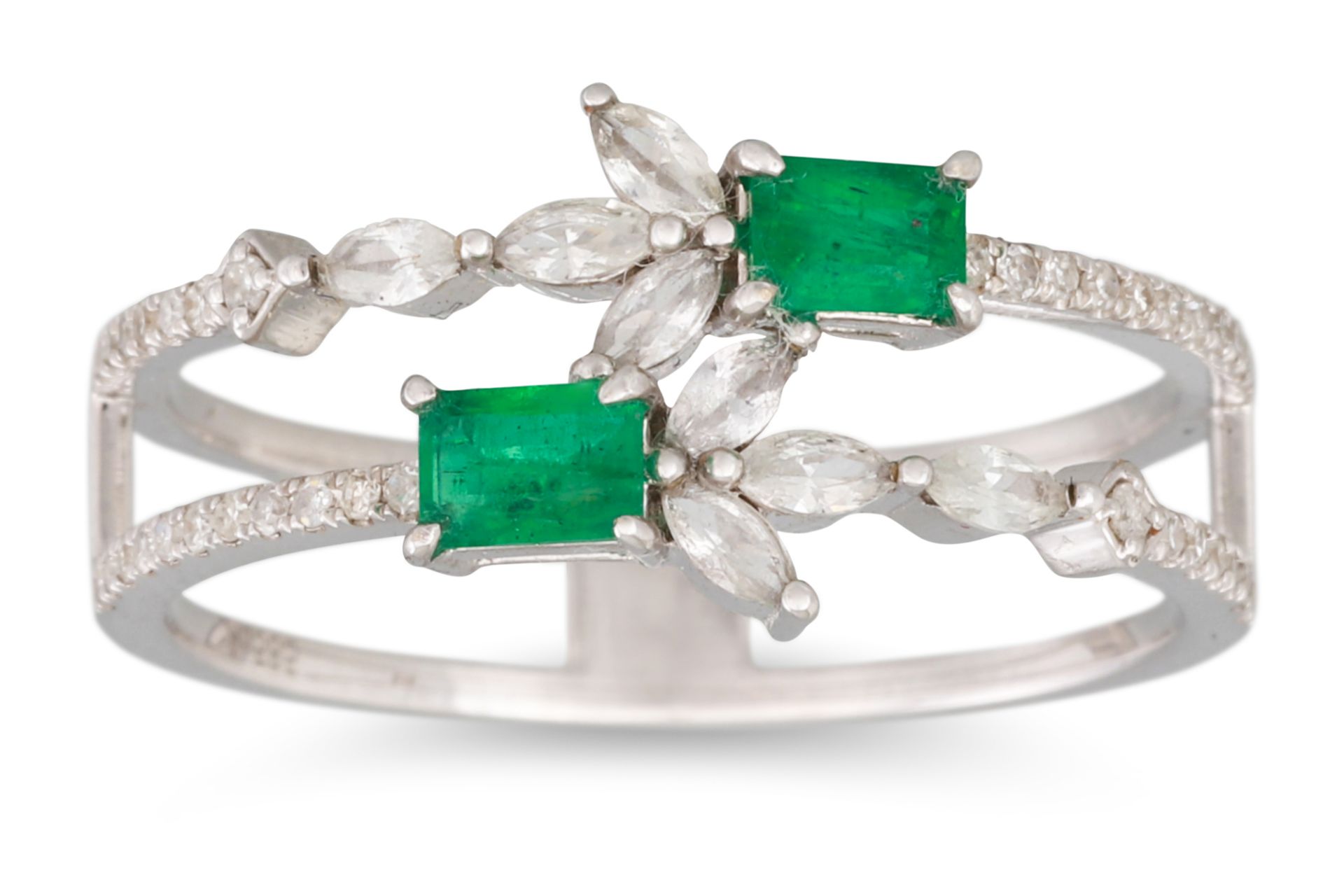 AN EMERALD AND DIAMOND RING, the two rowed ring set with marquise and brilliant cut diamonds,