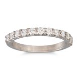 A DIAMOND HALF ETERNITY RING, the brilliant cut diamonds mounted in platinum. Estimated: weight of