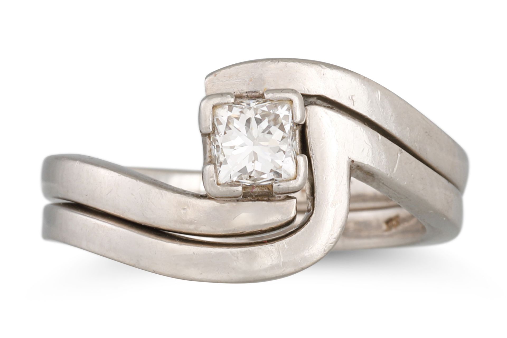 A DIAMOND SOLITAIRE RING, of cross over design, together with a keeper ring in platinum