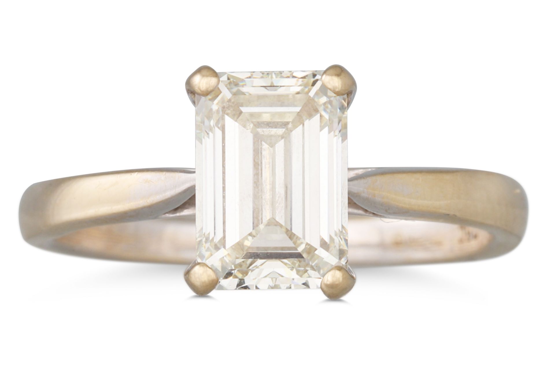 A DIAMOND SOLITAIRE RING, the emerald cut diamond mounted in 18ct white gold. Together with copy GIA