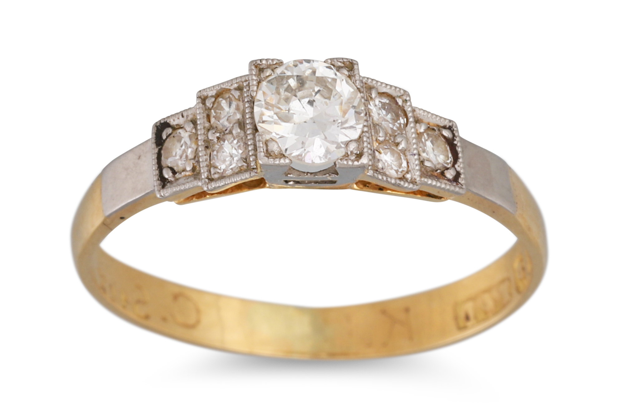 A LATE ART DECO DIAMOND RING, the old cut diamond to stepped diamond shoulders, dated 1938,