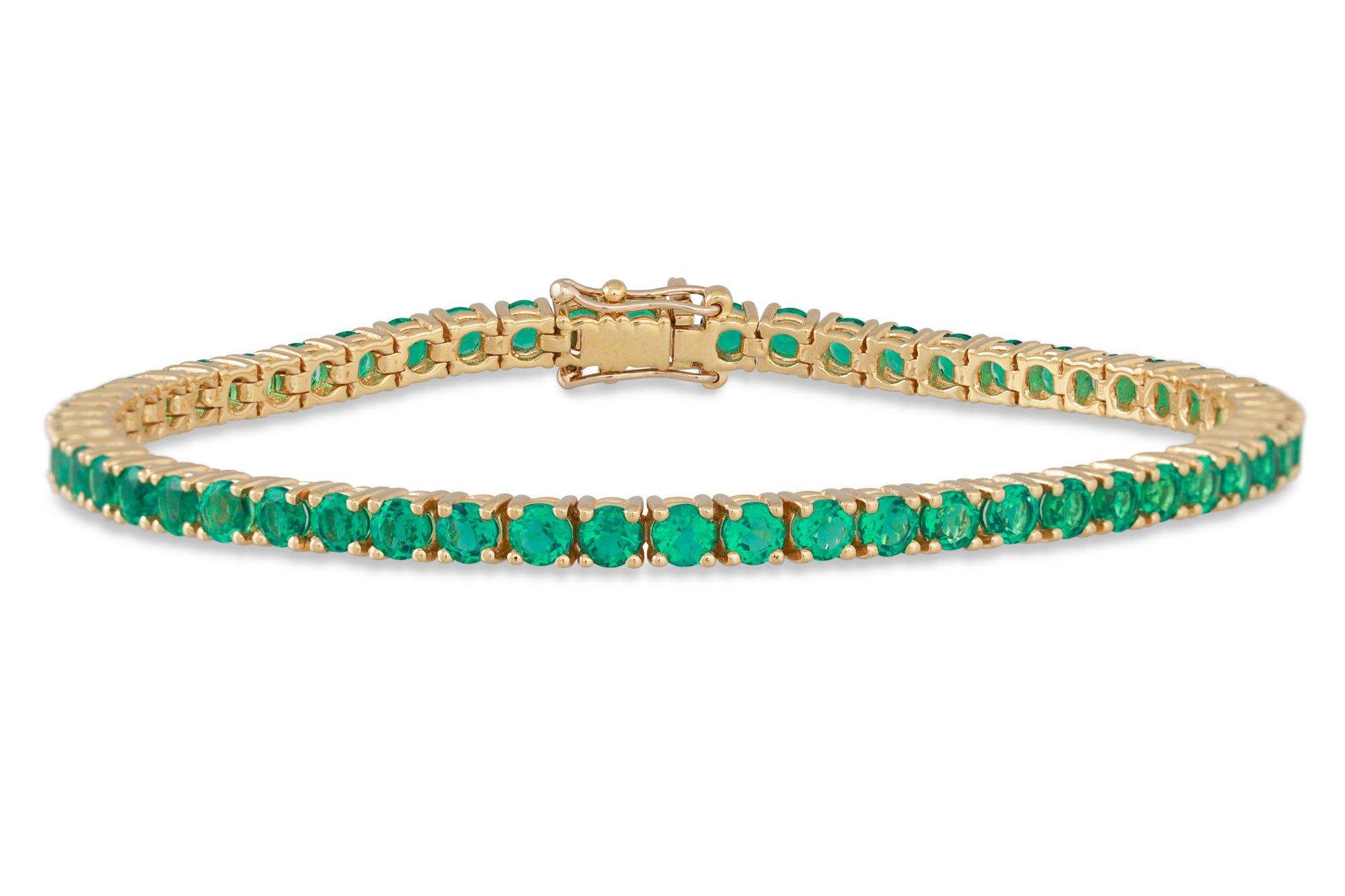 AN EMERALD LINE BRACELET, the circular stones mounted in 18ct gold. Estimated: weight of emeralds: