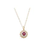 A DIAMOND AND RUBY PENDANT, on a chain