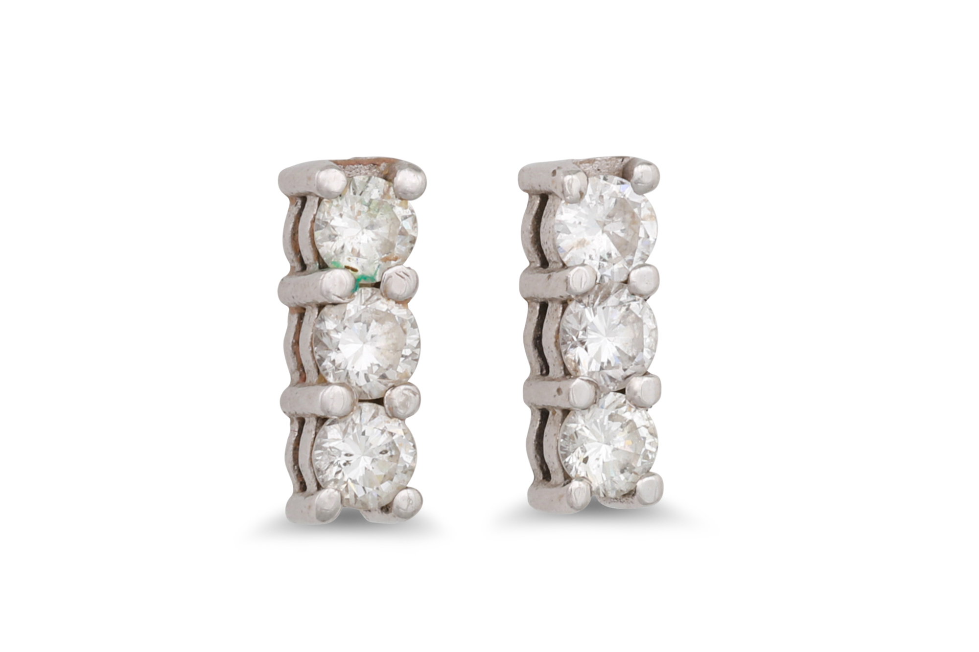 A PAIR OF THREE STONE DIAMOND EARRINGS, in white gold. Estimated: weight of diamonds: 0.60 ct.