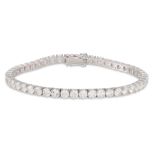 A DIAMOND LINE BRACELET, the brilliant cut diamonds mounted in 18ct white gold. Estimated: weight of