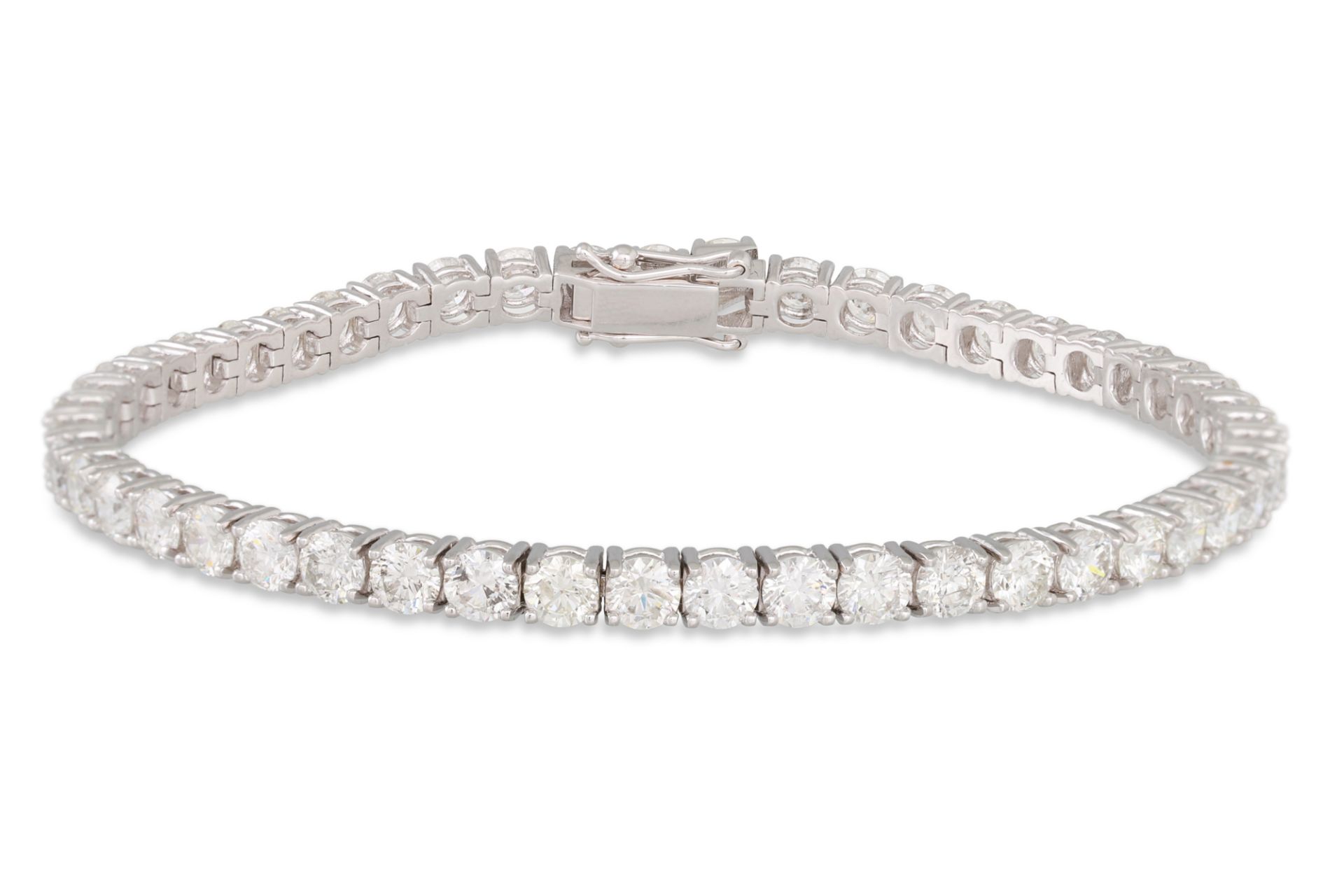 A DIAMOND LINE BRACELET, the brilliant cut diamonds mounted in 18ct white gold. Estimated: weight of
