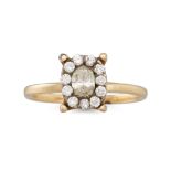A DIAMOND CLUSTER RING, mounted in yellow gold. Estimated: weight of centre diamond: 0.50 ct. size