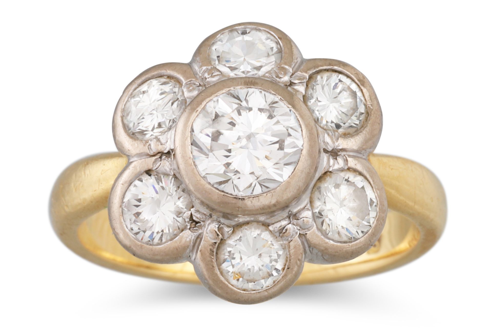 A DIAMOND CLUSTER RING, the brilliant cut diamonds set daisy form, mounted in 18ct yellow gold.