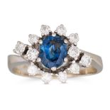 A SAPPHIRE AND DIAMOND CLUSTER RING, the oval sapphire to diamond surround, mounted in 14ct white