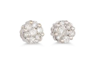 A PAIR OF DIAMOND CLUSTER EARRINGS, the brilliant cut diamonds mounted in white gold