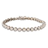 A DIAMOND LINE BRACELET, collet set, mounted in 18ct white gold. Estimated: weight of diamonds: 2.64