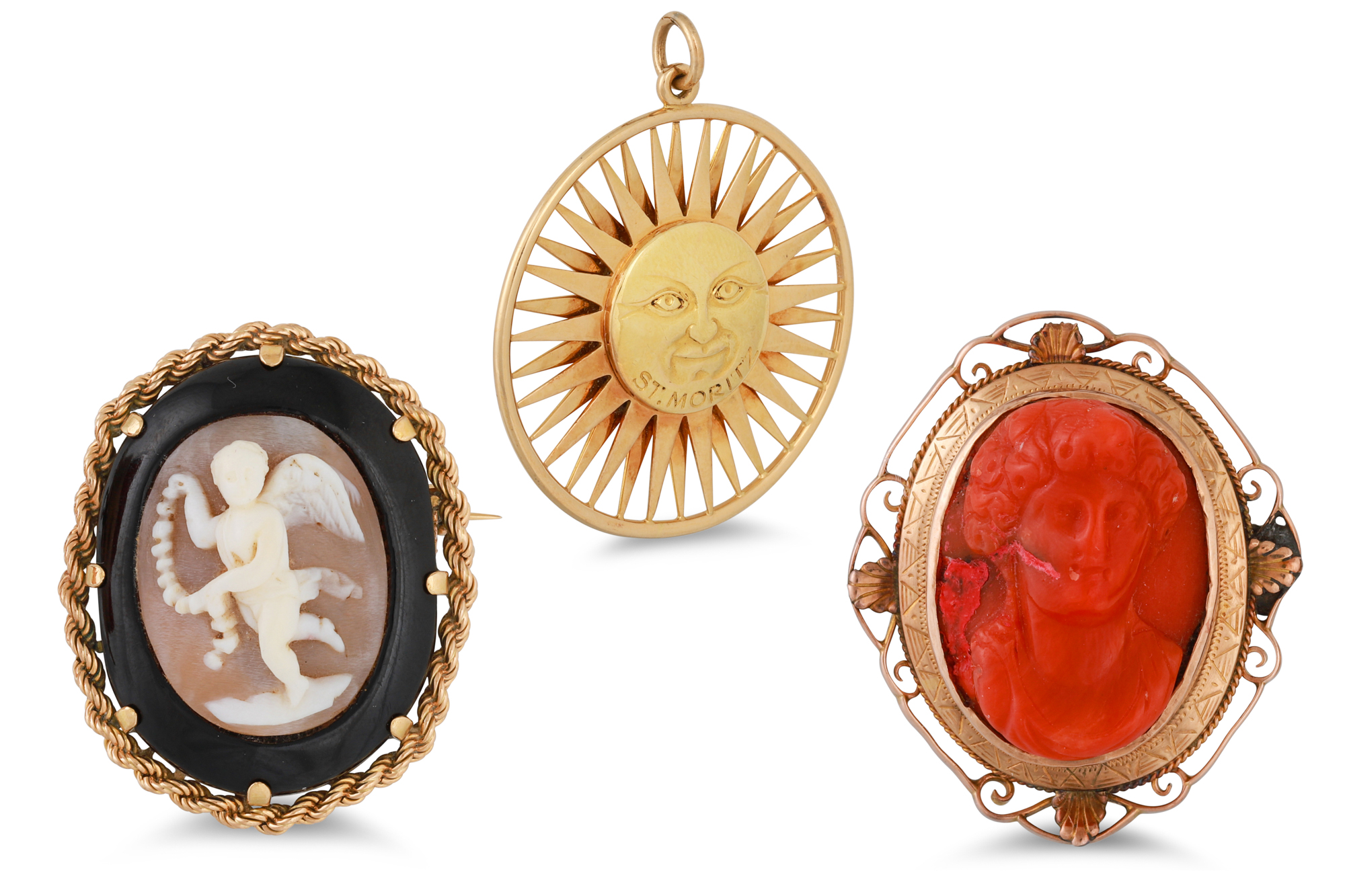 A CARVED CORAL AND 9CT GOLD BROOCH, a gold morning brooch and a sunburst 'St. Moritz' pendant