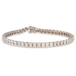 A DIAMOND LINE BRACELET, the brilliant cut diamonds mounted in 18ct gold. Estimated: weight of
