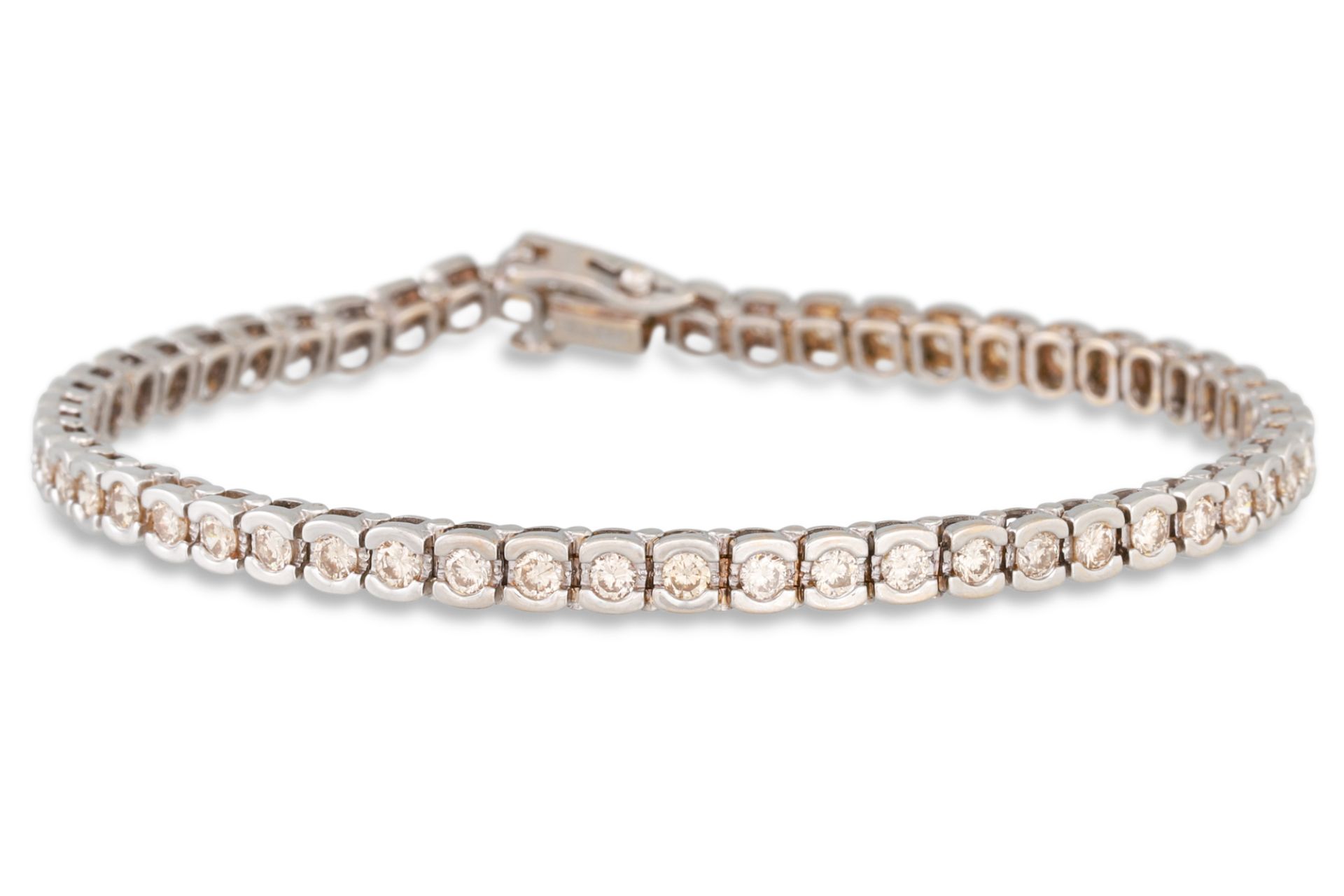 A DIAMOND LINE BRACELET, the brilliant cut diamonds mounted in 18ct gold. Estimated: weight of