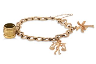 A 9CT GOLD FANCY LINK CHARM BRACELET, suspending three charms, 19.9 g.