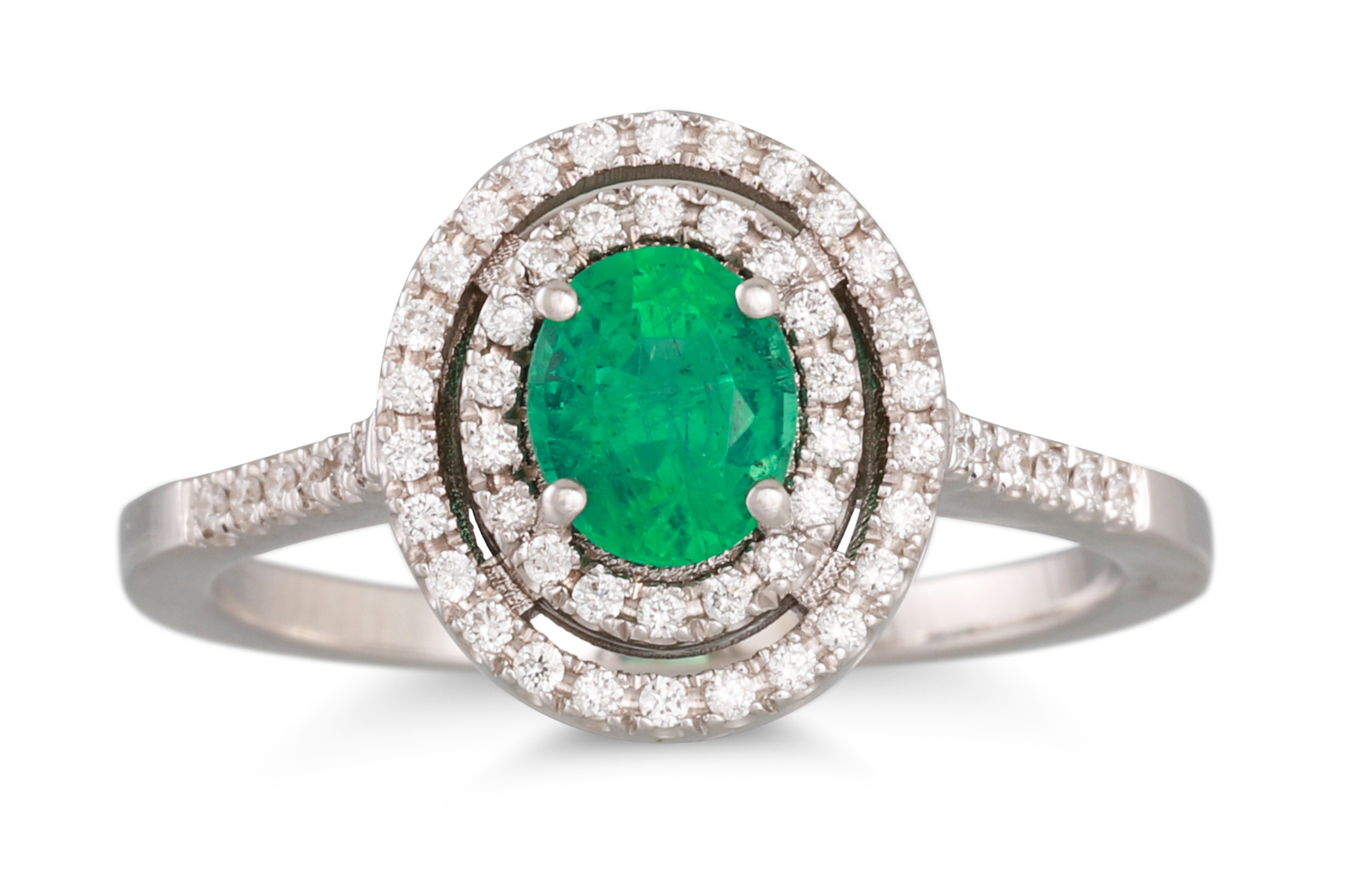 AN EMERALD AND DIAMOND CLUSTER RING, the oval emerald to a two rowed diamond surround and shoulders,