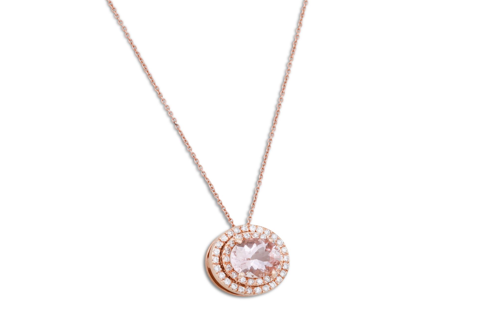 A MORGANITE AND DIAMOND CLUSTER PENDANT, of oval form, mounted in pink gold, on a pink gold chain.