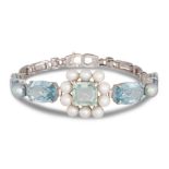 AN AQUAMARINE AND CULTURED PEARL BRACELET, the central cluster to aquamarine and pearl bracelet,