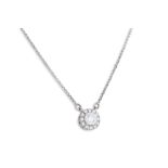 A DIAMOND CLUSTER PENDANT, of halo form, the brilliant cut diamonds mounted in 18ct white gold, on a