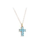 A TOPAZ AND 9CT GOLD CROSS, on a 9ct gold chain