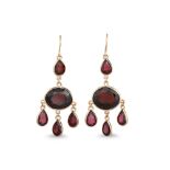 A PAIR OF GARNET DROP EARRINGS, gold mounted in chandelier style, Shepard hook fitting