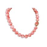 A CORAL BEADED NECKLACE, to a 14ct yellow gold clasp, diameter 15 mm - 12 mm.