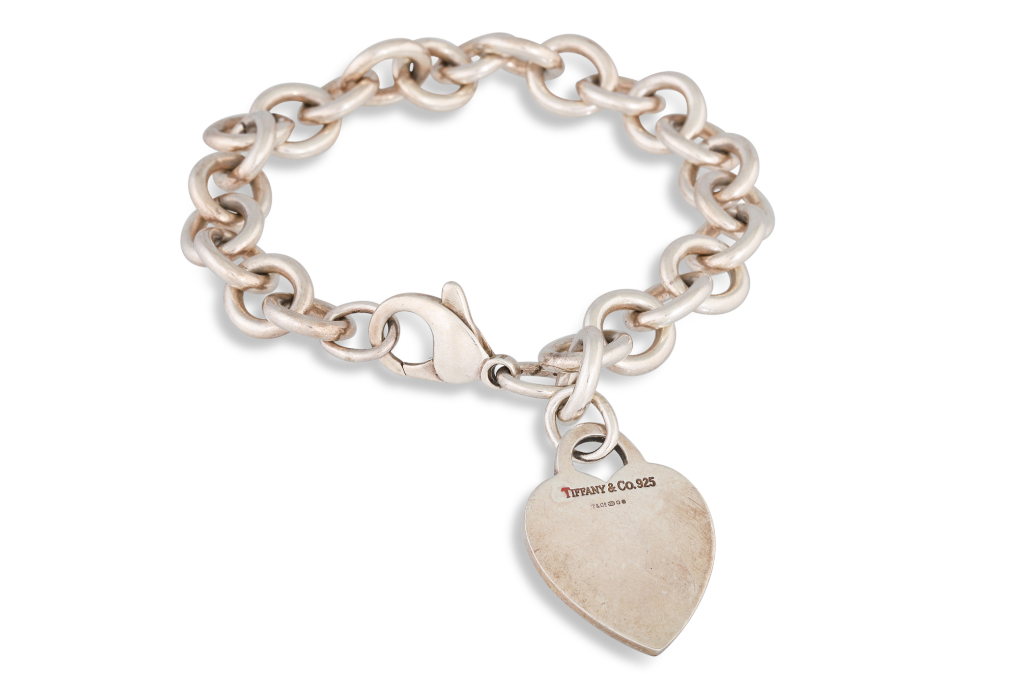 A SILVER BRACELET, with Tiffany heart charm